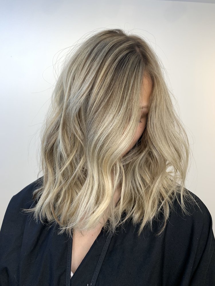 Shoulder-length icy blonde balayage with soft texture