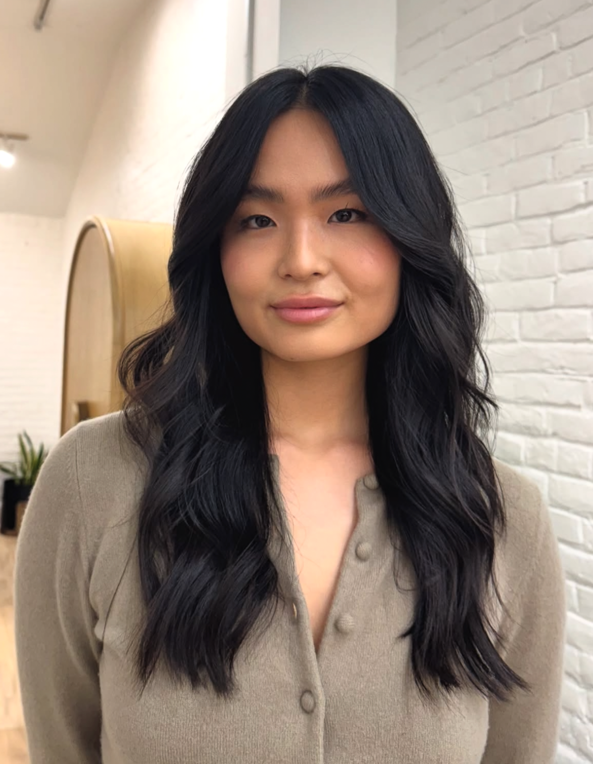 Long black waves with soft face-framing layers